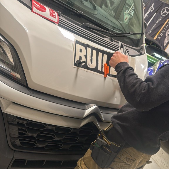 Professional van branding for ST Builders Service in London with custom vehicle graphics, premium vinyl wrap and modern construction branding.
